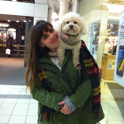 Claudia O'Doherty and her dog posing for a photo shoot.